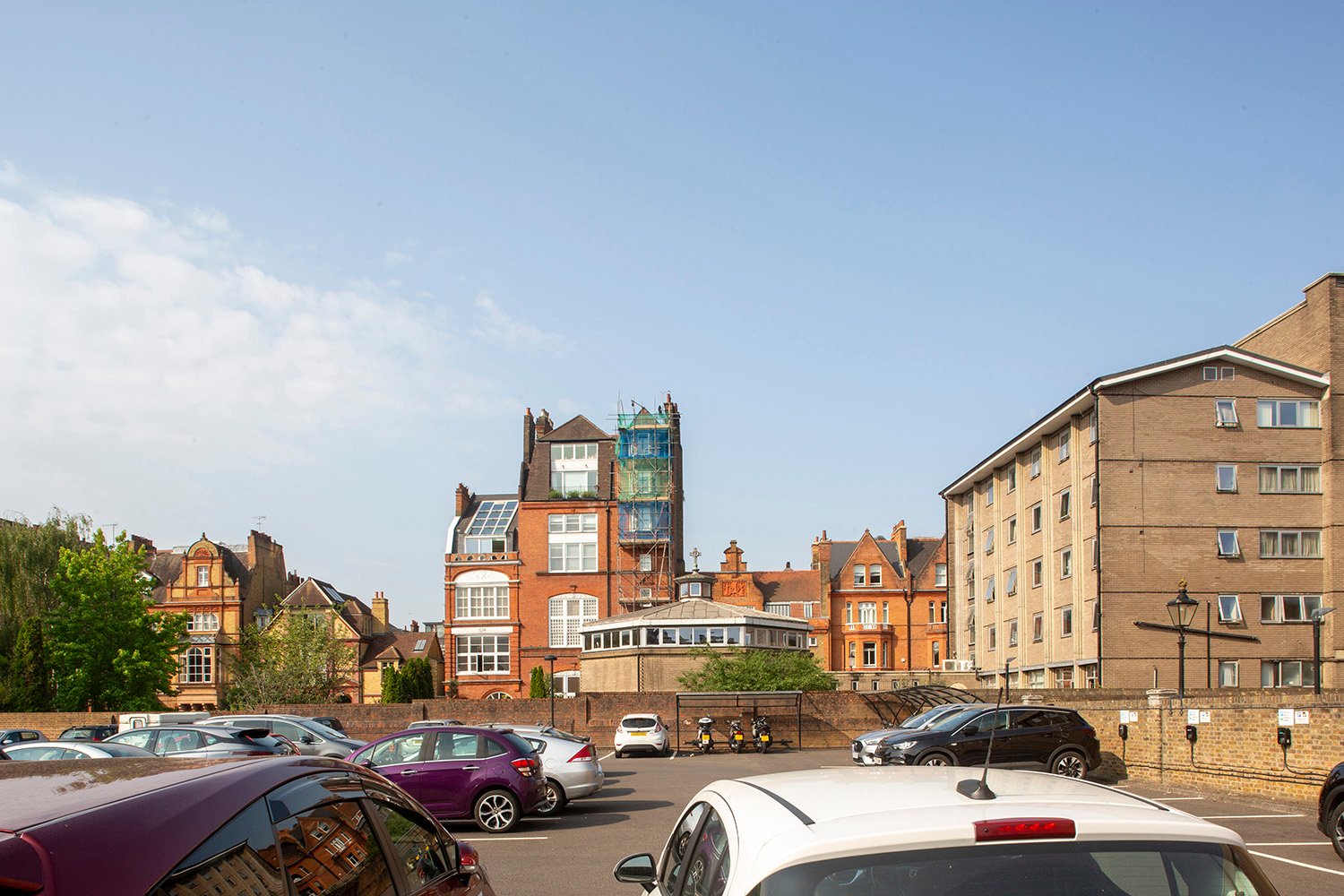 Before image: view from the National Army Museum car park, varied rooflines and generous sky gaps define the rear of Tite Street, with Tower House the tallest element.