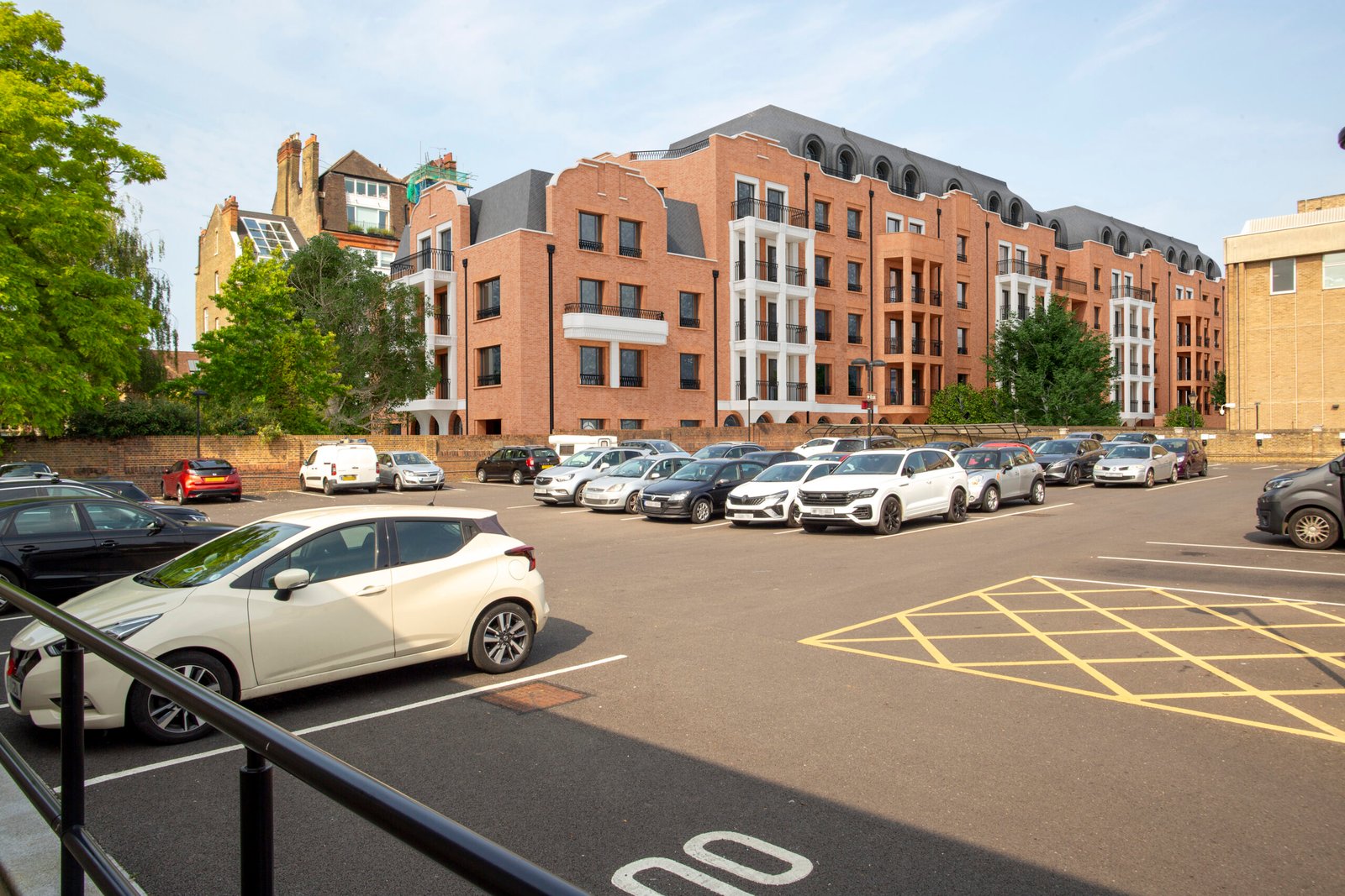 After inmage: view of an extended multi-storey block spans the scene, closing sky views and compressing the townscape.